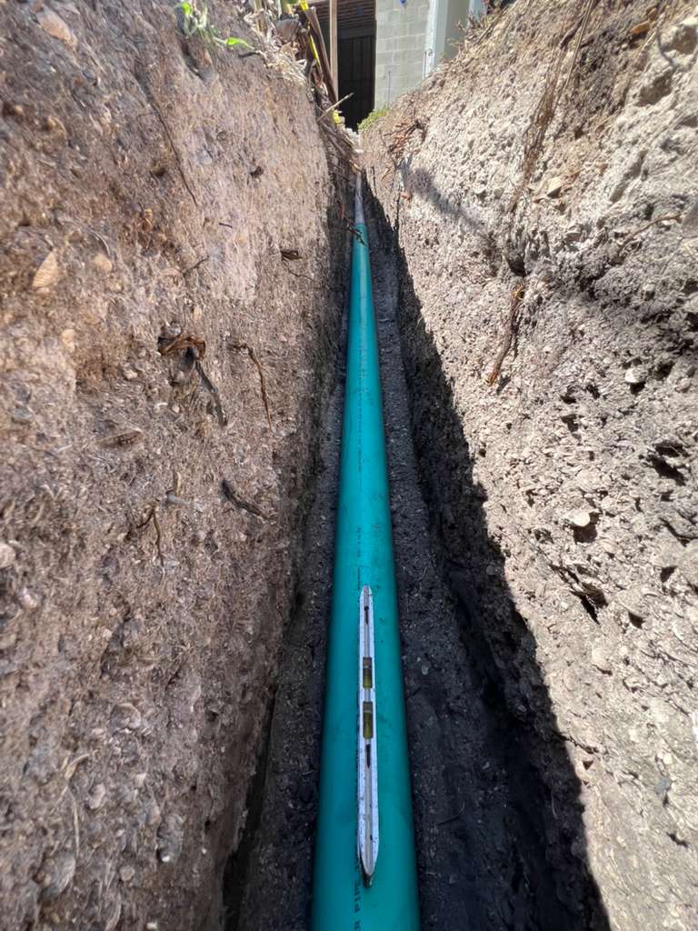 Underground residential plumbing line installation