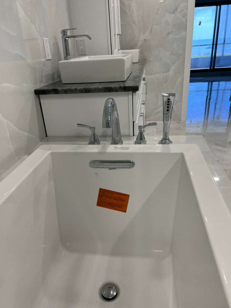 Finished bathtub and bathroom fixture installation